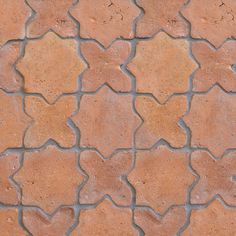 a close up view of a brick wall with small stars on the top and bottom