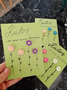 three pieces of paper with flowers on them