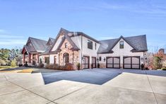 a large house with lots of windows and garages