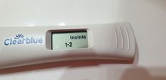 a close up of a thermometer on a white surface with clearblue incontta