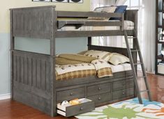 a bunk bed with drawers underneath it and a ladder on the bottom level, in a room with hardwood floors