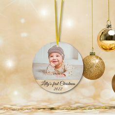 a christmas ornament with a baby's first christmas photo