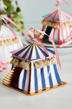 three small circus tents sitting on top of a table