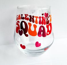 there is a wine glass with hearts on it