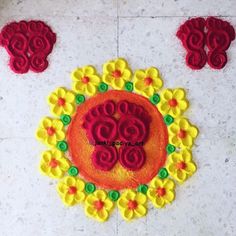 a decorated rangdi with flowers on the ground