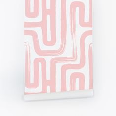 a pink and white notebook with an abstract design