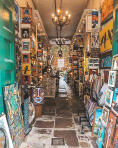 the inside of an art store with paintings on display