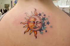 a woman with a sun and moon tattoo on her back