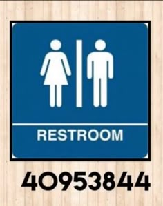 a restroom sign with the words restroom on it and an image of a man and woman