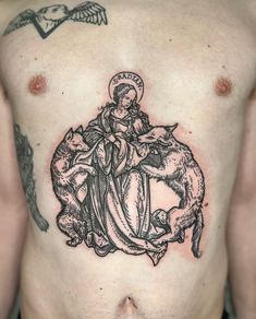 a man with a tattoo on his chest has an image of the virgin mary and dog