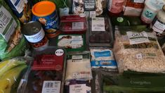 an assortment of food is displayed on the counter for purchase at a grocery store or restaurant