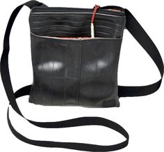 Lucille Recycled Bicycle Tire Purse  Grape Cat, Compassion Fashion | GrapeCat.com | @GrapeCats  The Lucille features a slim & minimalist 67 cross-body “portrait” design with a divided main compartment. The bicycle inner tube bag also features an external pocket for quick access to items while on-the-go.  #vegan #veganclothing #vegansweatshirt #veganapparel #style #sustainablefashion #ecofashion #whatveganswear Body Portrait, Vegan Clothing, Portrait Design, Bicycle Tires, Cross Body Purse, Eco Friendly Clothing, Inner Tube, Inner Tubes, Eco Fashion