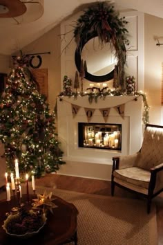 a living room filled with furniture and a fire place next to a christmas tree in front of a fireplace