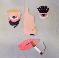 three pieces of cloth with scissors and eyeballs on them, including one piece of fabric