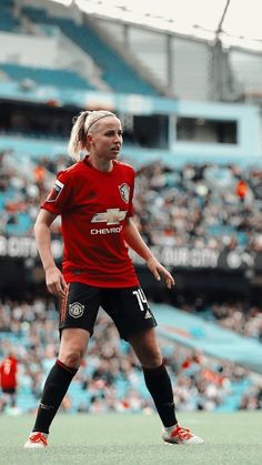 a female soccer player in action on the field