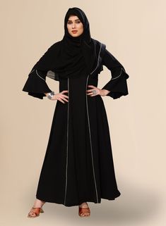 This elegant Pakistani Abaya for women, designed for the modern woman seeking both style and modesty. Crafted from high-quality polyester BSY fabric, this black abaya exudes sophistication and comfort. Its full length design abaya ensures modest coverage, while the fashion sleeves add a touch of contemporary flair. Complete with a nakab for added privacy, this abaya is perfect for any occasion. Pair it with your favorite sandals for a chic and effortless look. Modest Black Khimar, Long Black Abaya For Eid, Black Long Khimar For Eid, Modest Black Abaya With Long Sleeves, Modest Black Long Sleeve Abaya, Modest Long Sleeve Black Abaya, Modest Black Long Sleeve Khimar, Modest Long Sleeve Black Khimar, Long Sleeve Black Khimar For Eid