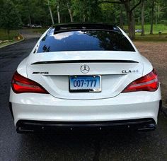 the back end of a white mercedes cla