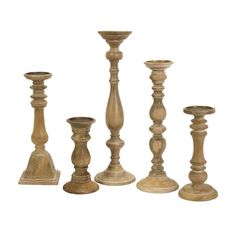 an assortment of wooden candlesticks on a white background