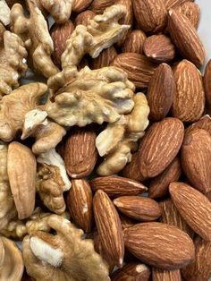 almonds and walnuts are mixed together in a pile