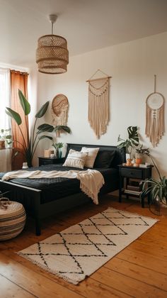 a bed room with a neatly made bed and plants on the wall next to it