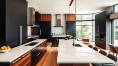 a modern kitchen with black cabinets and white counter tops