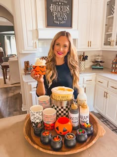 Leanna in front of a Halloween Ice Cream Bar on a wooden tray Halloween Sundae Bar, Halloween Ice Cream Sundae Bar, Halloween Ice Cream Sundae, Halloween Playdate Ideas, Halloween Ice Cream Bar, Halloween Sundae, Halloween Ice Cream Party, Ice Cream Bar Ideas