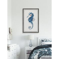 a bedroom with white walls and a seahorse painting on the wall