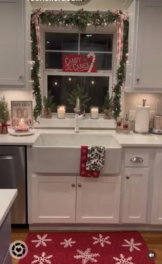 a kitchen decorated for christmas with candles and decorations