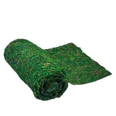 a roll of green grass on a white background