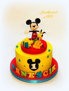 a mickey mouse birthday cake is shown on a white background with the words disney spelled out