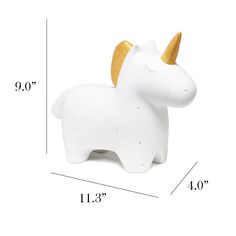 a white unicorn toy with gold horns on it's head and measurements for the size