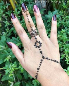 a woman's hand with a tattoo on it