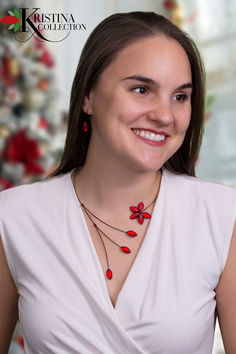 A young woman in a white dress wearing a glass bead necklace featuring a stylized floral and branches, shown in a monochromatic red. Ruby Red Necklace, Woodstock Ga, Artisan Necklace, Red Necklace, Open Design, Necklace And Earring Set, Memory Wire, Ruby Red, Woodstock