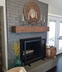 a living room with a fire place sitting on top of a hard wood floor