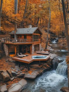 a log cabin with a hot tub in the foreground and a waterfall running through it