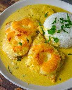 a white plate topped with food and rice