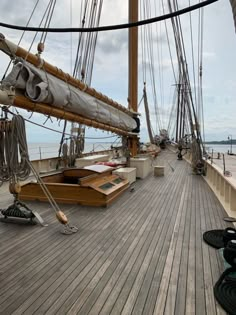 the deck of an old sailing ship with lots of ropes