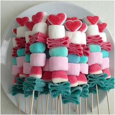 marshmallows are arranged on top of other marshmallows in the shape of hearts