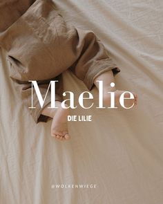 a person laying on top of a bed under a white sheet with the words maelie