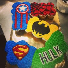 some cupcakes are decorated like superheros