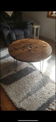 a coffee table sitting on top of a rug