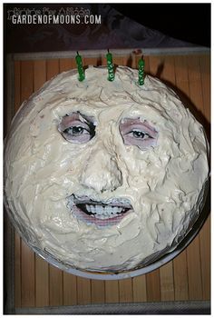 a cake with icing on top of it that looks like a man's face