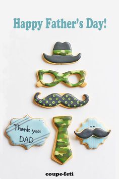 father's day cookies with mustaches, hats, and glasses on white background