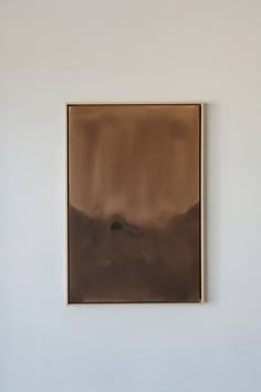 an abstract painting hangs on the wall