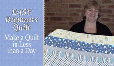 a woman holding up a quilt with the words easy beginner's quilt make a quilt in less than a day