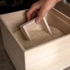 Exuding warmth, this simple, stackable rice bin is made by Masuda Kiribako, a specialist shop founded in 1929, and features an ingenious lid.Kiribako are boxes made of paulownia wood. Paulownia has humidity-controlling and insect-repelling properties that keep rice fresh and protect its flavor. This box is also suitabl Recycling Station, Stackable Bins, Grain Storage, Spice Racks, Glass Front Cabinets, Japanese Kitchen, Integrated Appliances, Modular Storage, Nails And Screws