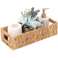 a basket with soap, toiletries and flowers in it