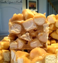 several pieces of food stacked on top of each other in front of a door and stairs