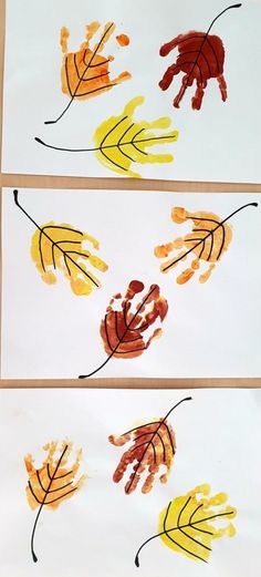 three handprints with leaves on them and one is painted yellow, orange and red