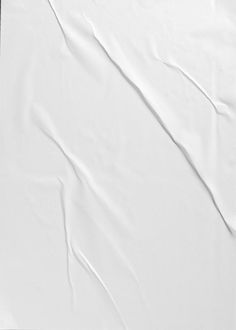 an empty sheet of white paper on a black background